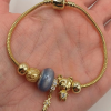 Charm karkötő medálokkal