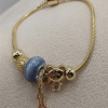 Charm karkötő medálokkal